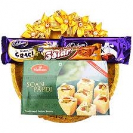Basket Of Sweets And Chocolates Decorated With Dry Flowers